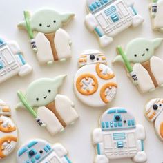 star wars decorated cookies are arranged on a table