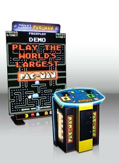 an arcade machine with the words play the world's largest pac - man on it