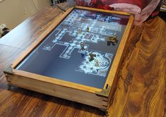 a wooden table with a board game on it