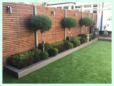 a wooden fence with some trees in it