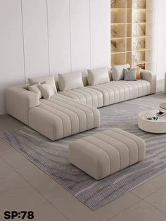 a living room filled with lots of white furniture