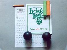 two balls and a pen on top of a paper with the irish roosting rules and strategy