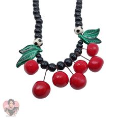 Pre-Owned Costume Jewelry Should Be Fun And That Can Certainly Be Said About The Whimsical And Never Boring Jewelry Created By Both Parrot Pearls And Flying Colors. Although They Are Contemporary They Are Already Quite Collectable And It Is Easy To See Why. This Bold Necklace Has Seven Bright Red Cherries That Dangle From The Center. Veined Green Leaves And Two Black Beads With White Polka Dots Are Strung Along With Black Rounds. The Clasp Is A Silver- Tone Barrel. The Hallmark Appears On This Whimsical Piece. Ca. 1980s. Bold Necklace, Black Beads, White Polka Dot, Bright Red, Vintage Ceramic, Green Leaves, Costume Jewelry, Womens Jewelry Necklace, Parrot