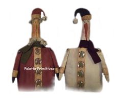 two stuffed animals are dressed in medieval clothing