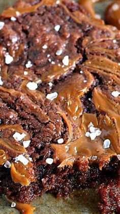 a close up of a piece of cake on a plate with caramel drizzle