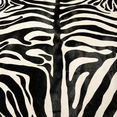 an animal print rug with black and white stripes