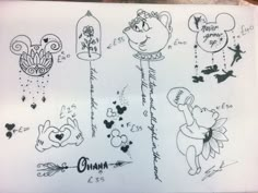 some drawings on a piece of paper that says ohana and mickey mouse with other disney characters