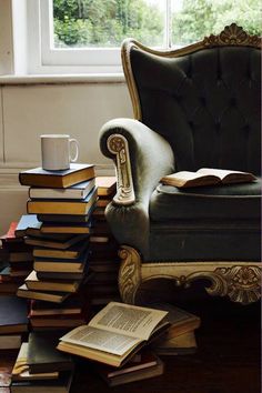 a chair sitting on top of a pile of books next to a stack of books