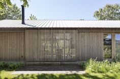 the house is made out of bamboo and has sliding glass doors