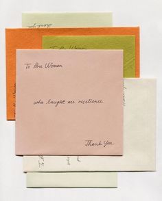 an envelope with the words to be a woman written on it