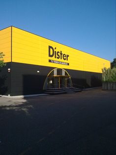 a yellow and black building with the word dister on it