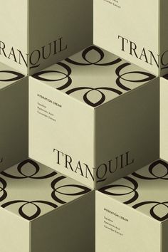 several boxes stacked on top of each other with the word tranquil in black and white