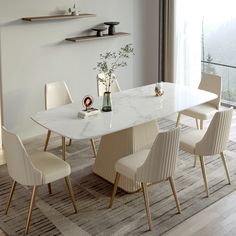 a dining room table with chairs around it