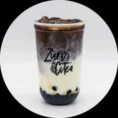 an iced drink with chocolate and cream in a plastic cup