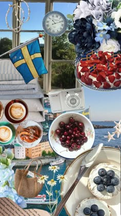 a collage of food and drinks on a table next to a window with the ocean in the background