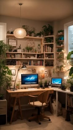 a desk with two computers on top of it next to a plant filled wall in front of a window