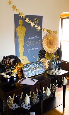 an oscar awards party with black and gold decorations