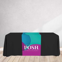 a table with a black table cloth and purple sign on the top that says posh