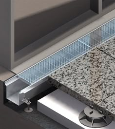 an image of a bathroom setting with granite counter top and stainless steel shower grate