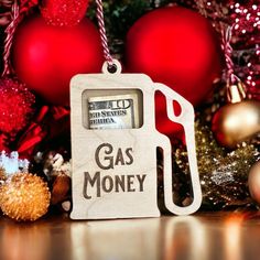 a gas pump ornament hanging from a christmas tree