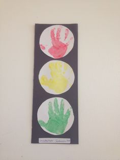 two hand prints on a black and white wall