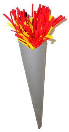 a paper cone with red and yellow sticks sticking out of it