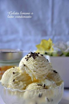 two scoops of ice cream in a glass bowl