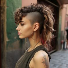 60 Undercut Women Hairstyles: Daring and Stylish Ideas For 2024 Shag Mullet With Undercut, Womens Mohawk Haircut, Undercut Mullet Women Long, Mohawk Undercut Women, Mohawk Long Hair For Women, Fall Undercut Designs, Grey Mohawk Women, Side Head Shaved Short Hair, Full Undercut Women