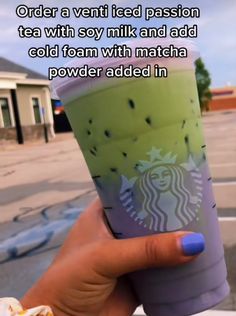 someone holding up a starbucks drink with the caption order a venti iced passion tea with soy milk and add cold foam with match powder added in