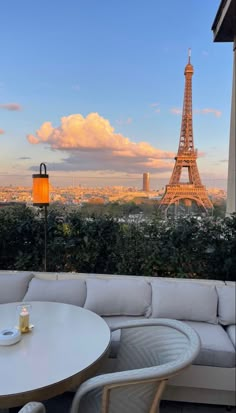 the eiffel tower is in the distance from this patio