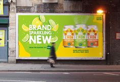 an advertisement on the side of a building advertising lemonade and sparkling new flavored beverages