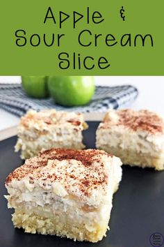 three pieces of apple and sour cream slice on a black plate with green apples in the background