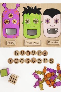 some paper cut outs with monsters on them and words that spell out the word hungry monsters