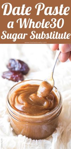 a jar filled with peanut butter on top of a white cloth next to an orange peel