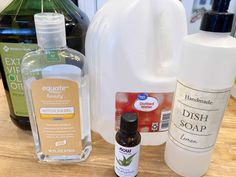 the ingredients to make diy hand soap are displayed on a wooden table with bottles