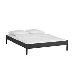 an image of a bed with white sheets and pillows on the headboard or foot board