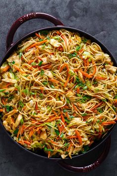 a skillet filled with noodles and vegetables