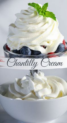 two bowls filled with whipped cream and blueberries on top of each other in front of a sign that says vanilla cream