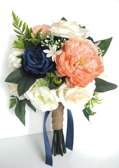 a bridal bouquet with blue ribbon and peach roses is displayed on an iphone screen