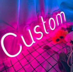 a neon sign that says custom on it