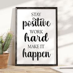 a black and white poster with the words stay positive work hard make it happen next to a potted cactus