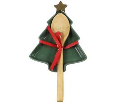 a wooden spoon in the shape of a christmas tree with a red ribbon on it