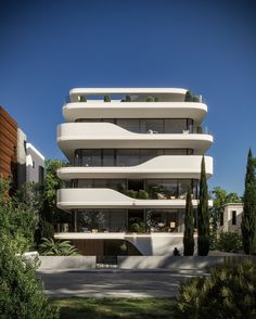 an apartment building with balconies on the top floor