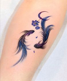 an artistic tattoo on the leg of a woman