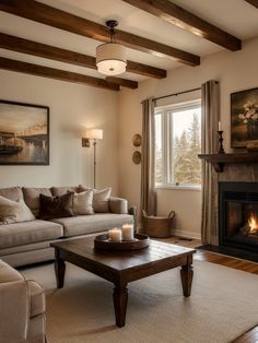 a living room filled with furniture and a fire place in front of a large window