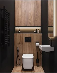 a modern bathroom with wood paneling and black walls