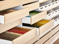 drawers with colored pencils in them are open