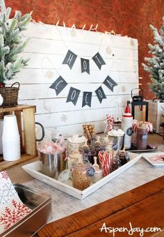 a table topped with lots of candy and christmas decorations