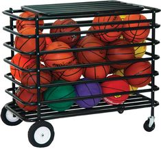 a cart filled with basketballs and balls on top of each other in different colors