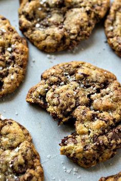 chocolate chip cookies sitting on top of a baking sheet